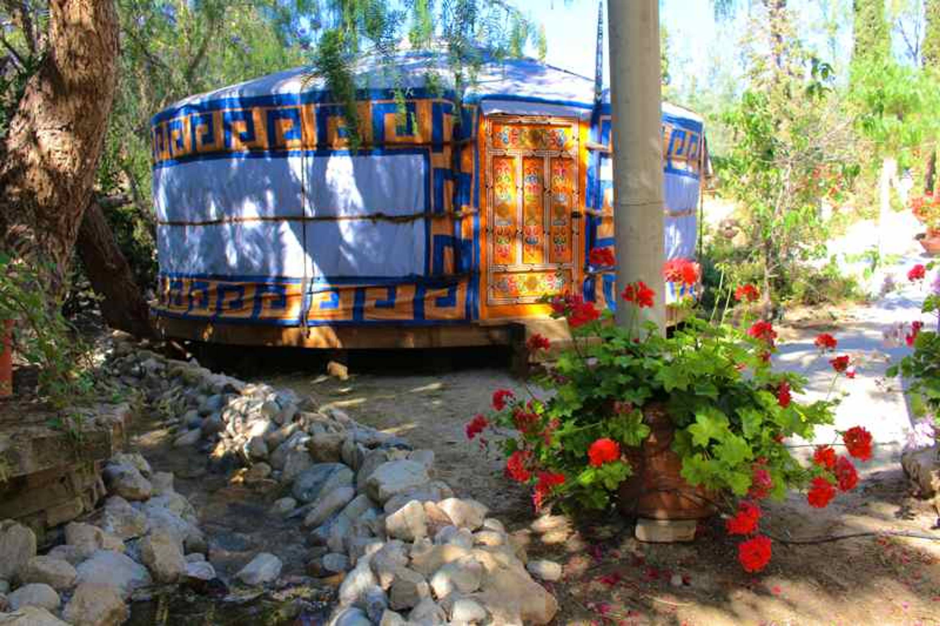spain yurt yellow blue geraniums